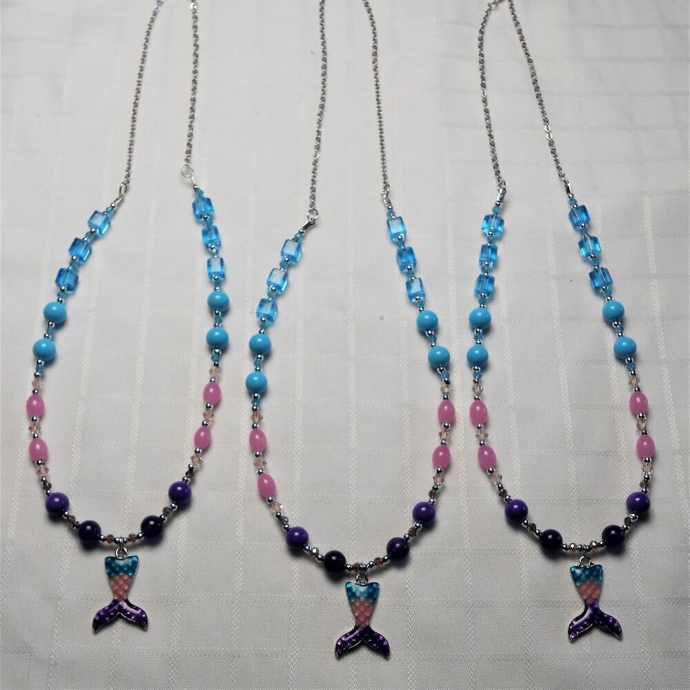 Beautiful mermaid necklace with enameled silver charm and acrylic and metal bead